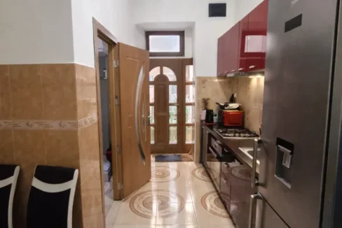 Bright kitchen with red accents