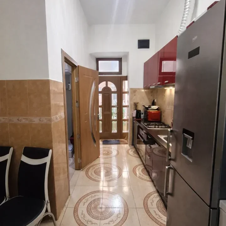 Bright kitchen with red accents