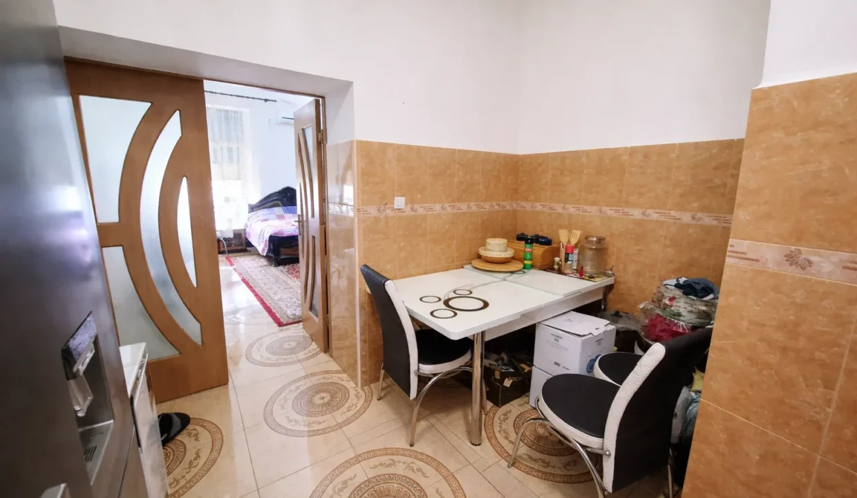 Kitchen view to a cozy bedroom