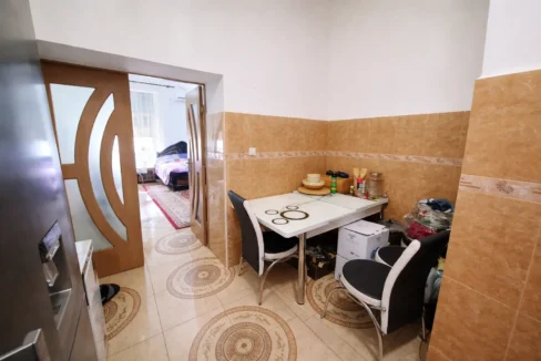 Kitchen view to a cozy bedroom