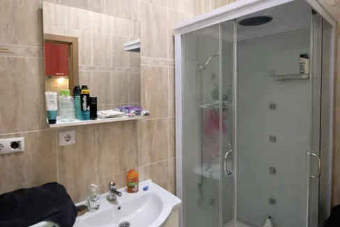 Modern bathroom with beige tiles