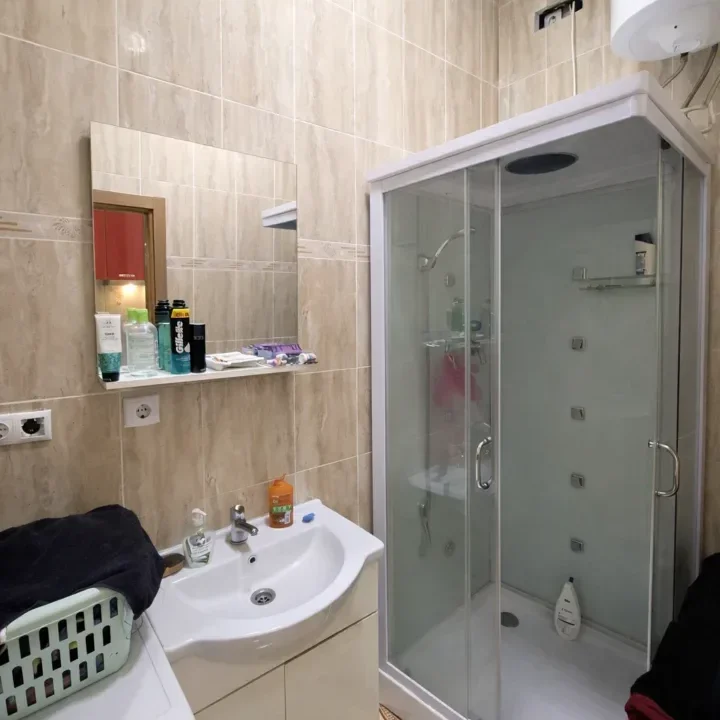 Modern bathroom with beige tiles