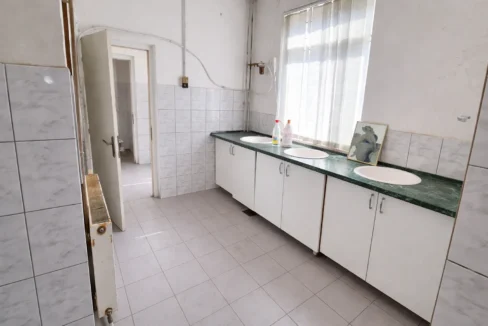 Bright utility room with green marble countertops