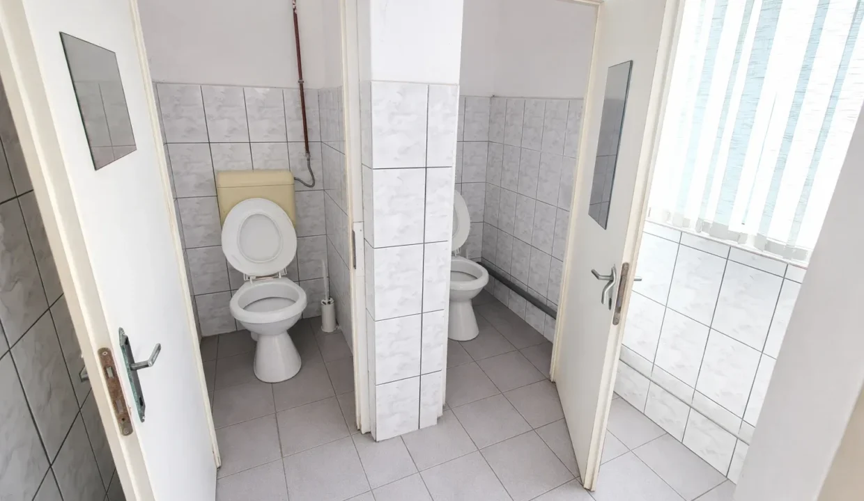 Clean public restroom with open stalls