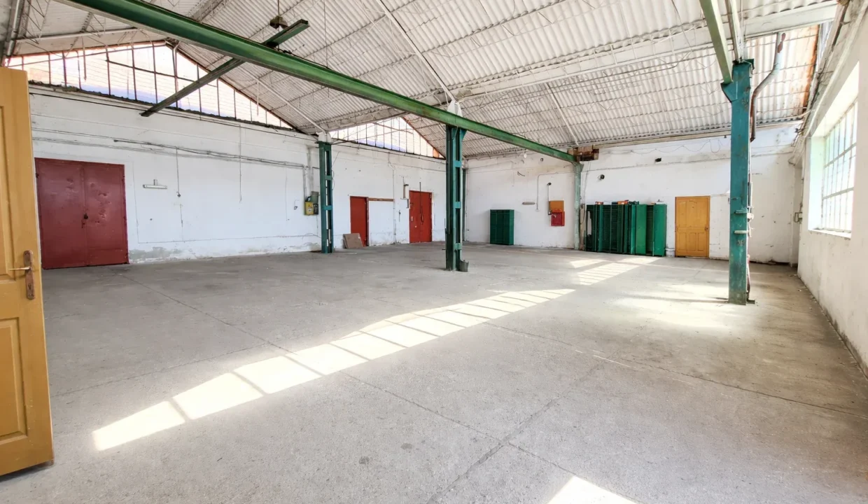 Industrial warehouse interior with sunlight (1)