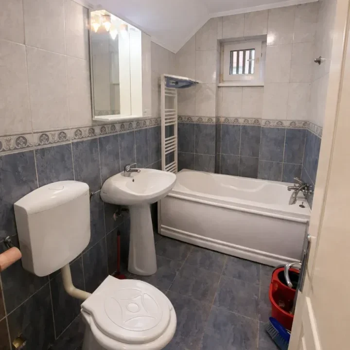 Modern bathroom with grey and blue tiles