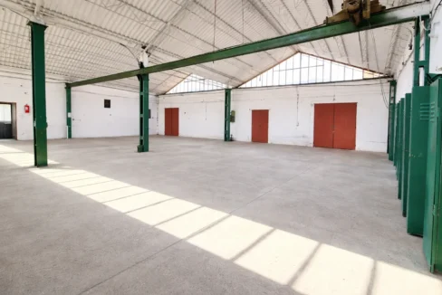 Pristine empty warehouse with natural light